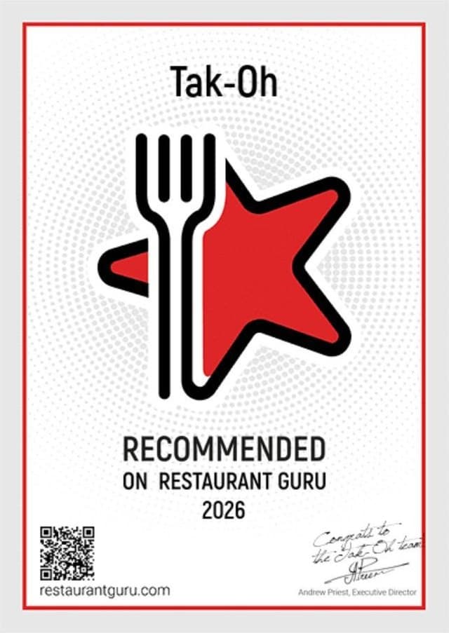Restaurant Guru 2026 certificate for Tak-Oh: a black fork crossed with a red star, reading 'Recommended on Restaurant Guru 2026'